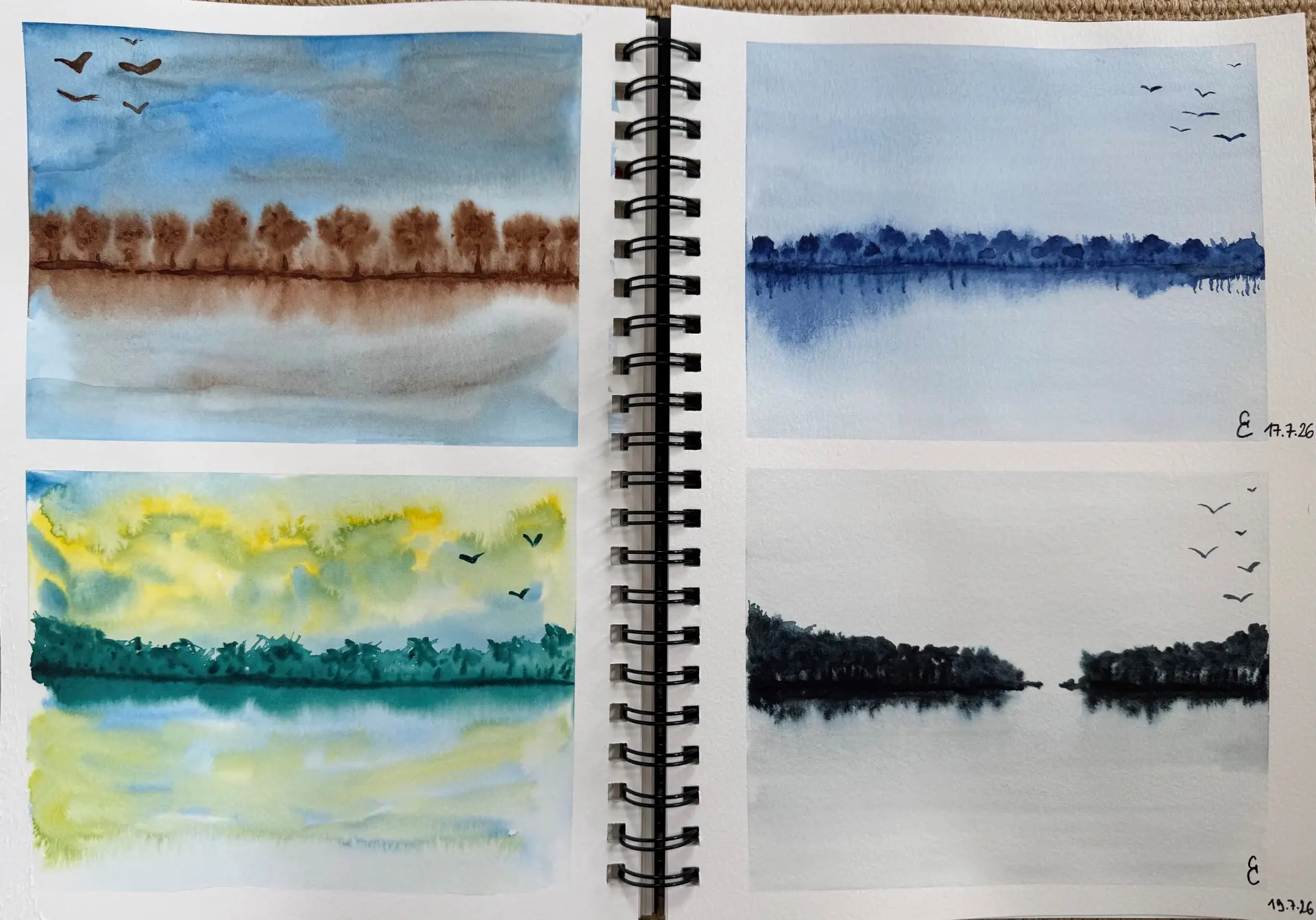 Student watercolour sketchbook of treeline reflections across water
